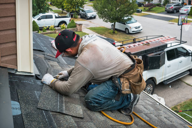 Professional Storm Damage Roof Repair technician working in Madison, OH